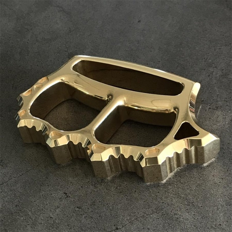 Full view of thickened brass knuckle duster with mirrored finish