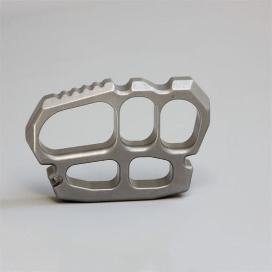 Solid stainless steel four finger knuckle duster front view on white background