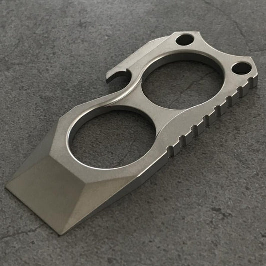 Titanium 2-finger crowbar knuckle duster front view on stone surface