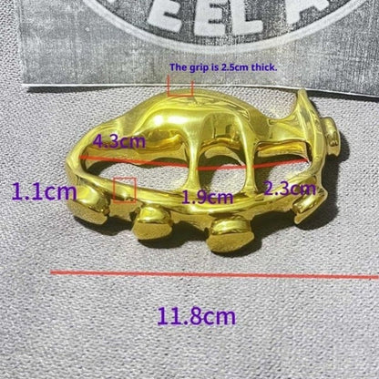 Polished golden brass knuckle duster front view showing sculpted design
