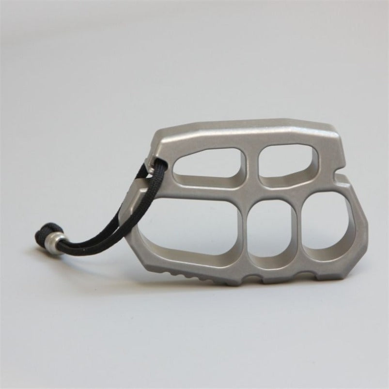 Stainless steel knuckle duster side profile showing thickness and finger holes