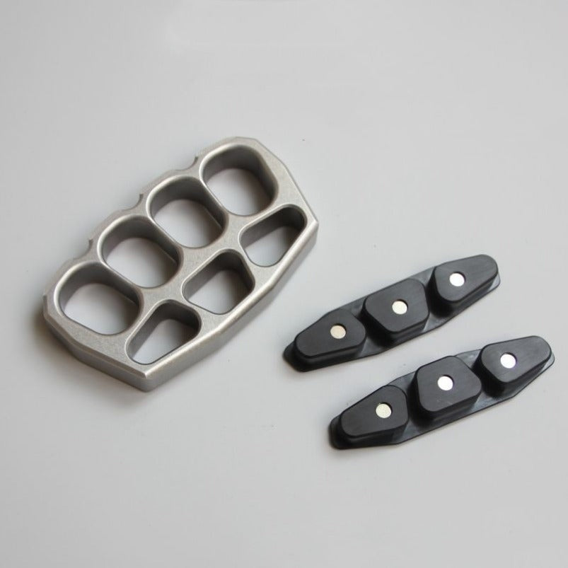 Side profile of magnetic steel knuckle duster showing clip and breaker