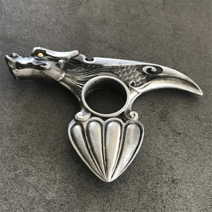 Retro silver dragon knuckle duster side view showing dragon head