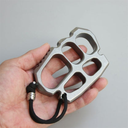 Angled view of stainless steel knuckle duster with bead blasted finish
