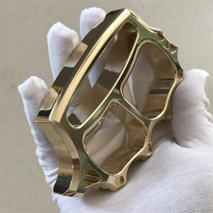 Close-up of brass knuckle duster jagged window breaker edge