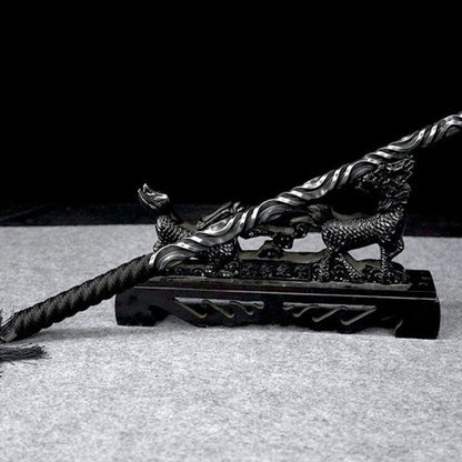 Full length view of martial arts hand stick on stand