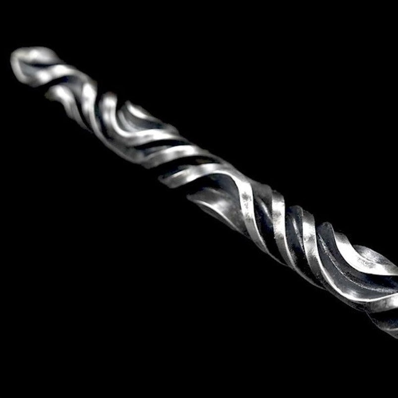 Close-up of hand stick twisted fluting texture