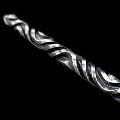 Close-up of hand stick twisted fluting texture