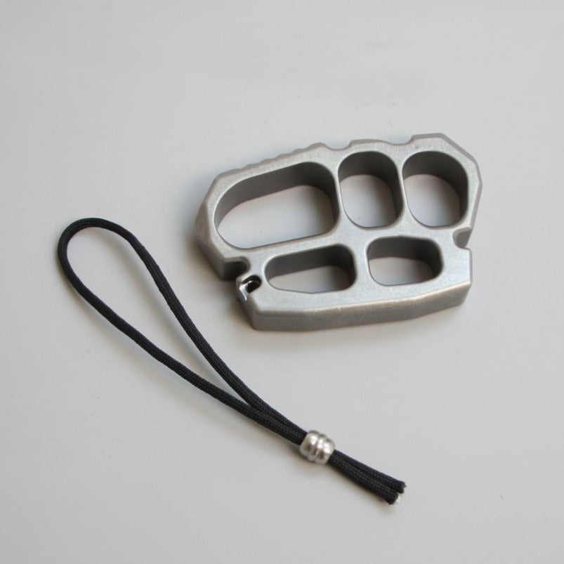 Close-up of stainless steel knuckle duster surface finish and edges