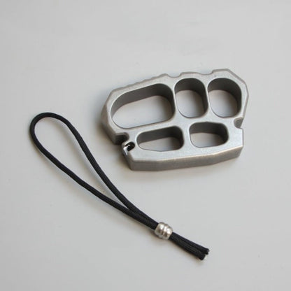 Close-up of stainless steel knuckle duster surface finish and edges