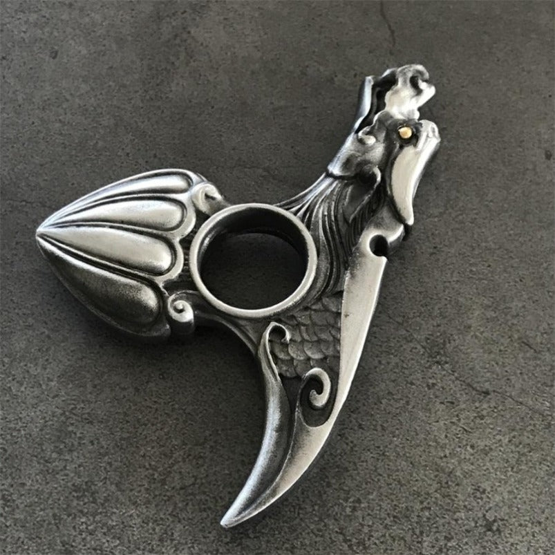 Silver dragon knuckle duster finger hole and scale detail