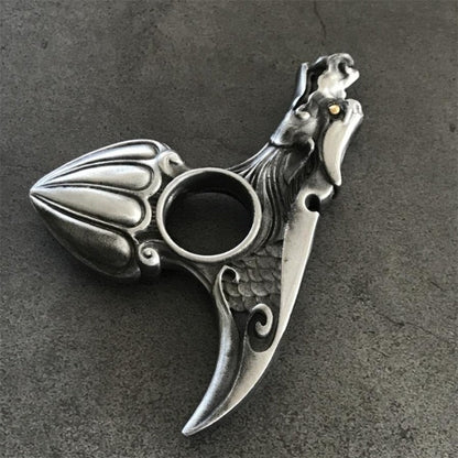 Silver dragon knuckle duster finger hole and scale detail