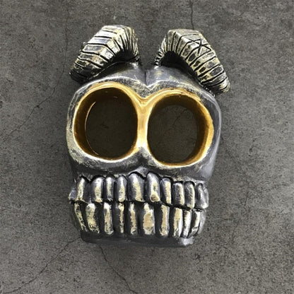 Top angle of skull knuckle duster showing two finger holes