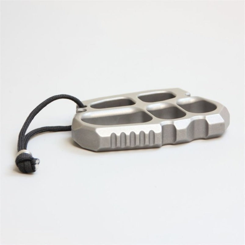 Detail shot of stainless steel knuckle duster thumb rest