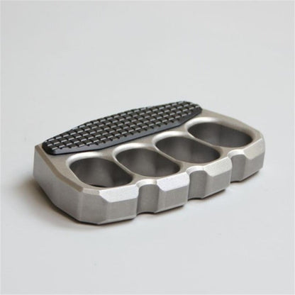 Angled view of magnetic steel knuckle duster on white background