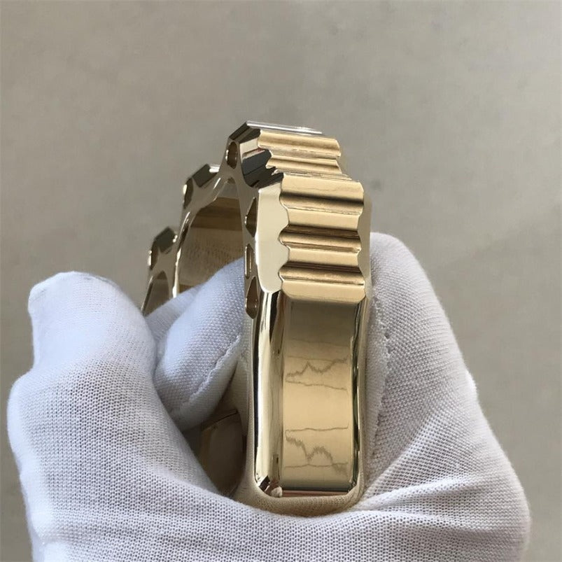 Brass knuckle duster lifestyle shot on light surface