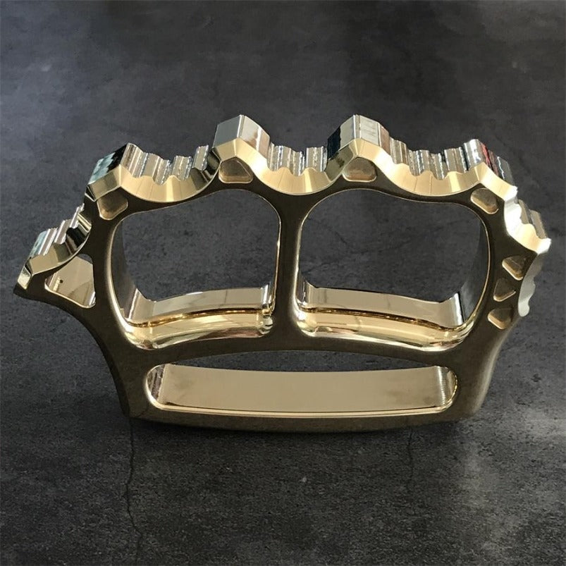 Close-up of brass knuckle duster finger hole edges