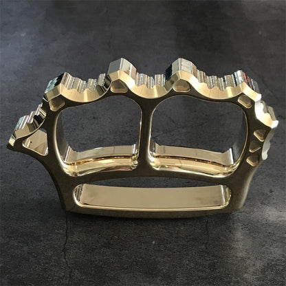 Close-up of brass knuckle duster finger hole edges
