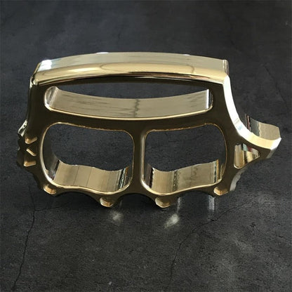 Top angle of brass knuckle duster showing window breaker profile