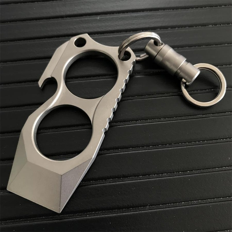 Two finger crowbar knuckle duster held in hand