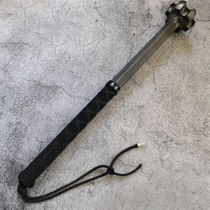 Half-wrap steel shatter hammer with carbon steel head, lanyard attached, on concrete