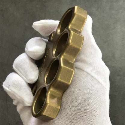 Side view of GODEDC brass knuckle duster showing solid thickness and antique brushed finish