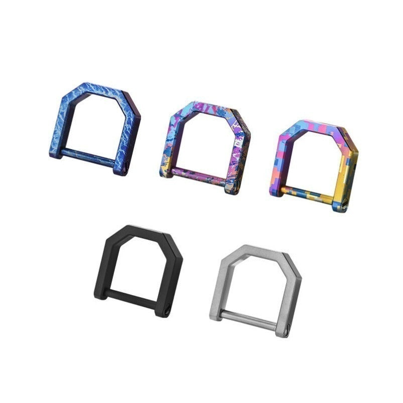 Five mini titanium D-ring carabiners on white showing blue, purple, gold, black and silver finishes